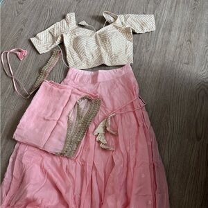 Pink lengha with cream blouse